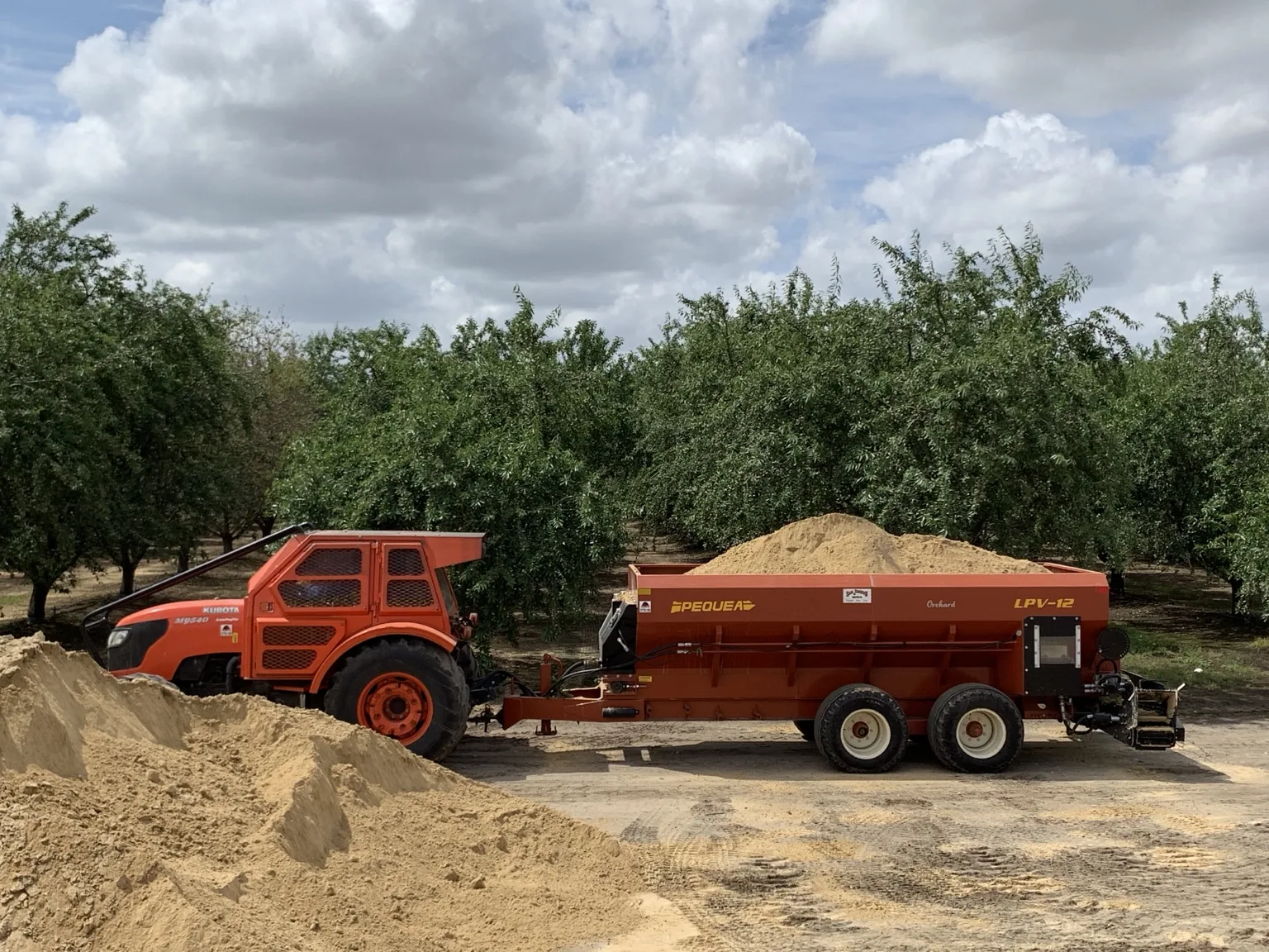 Pequea spreader loaded with soil amendment in an orchard